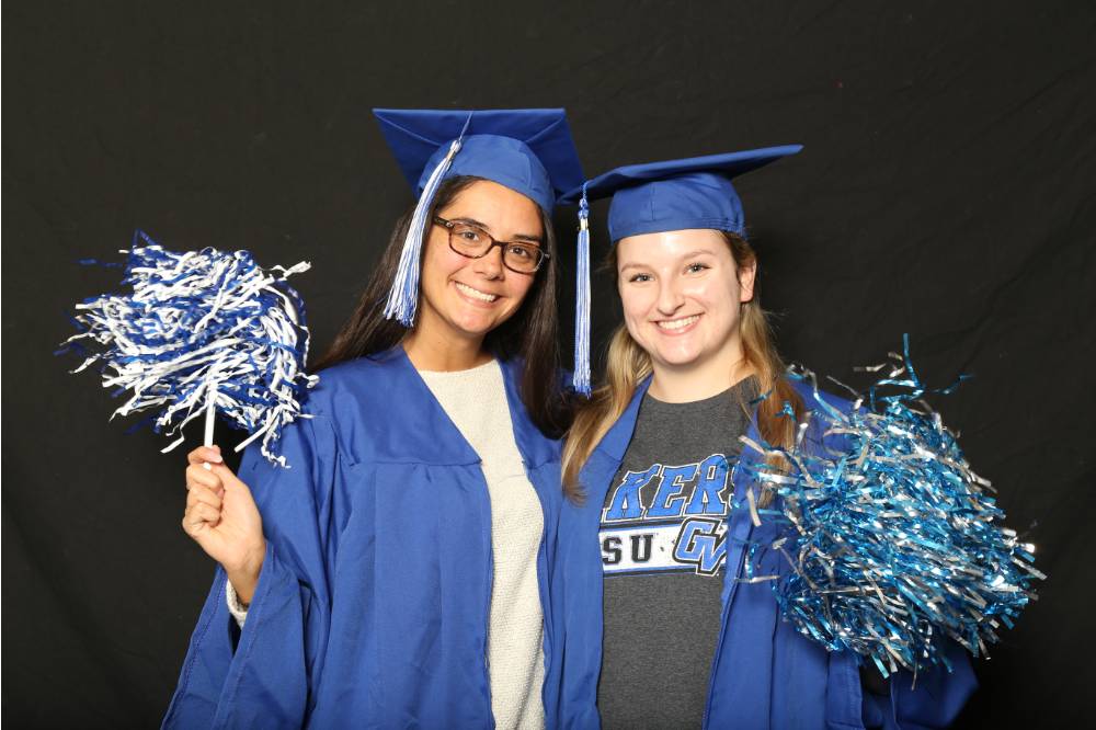 two students with pom poms